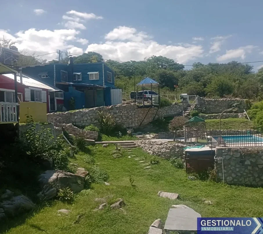 CABAÑAS Y CASA DE 2 DORMITORIOS EN HUERTA GRANDE - Imagen 1